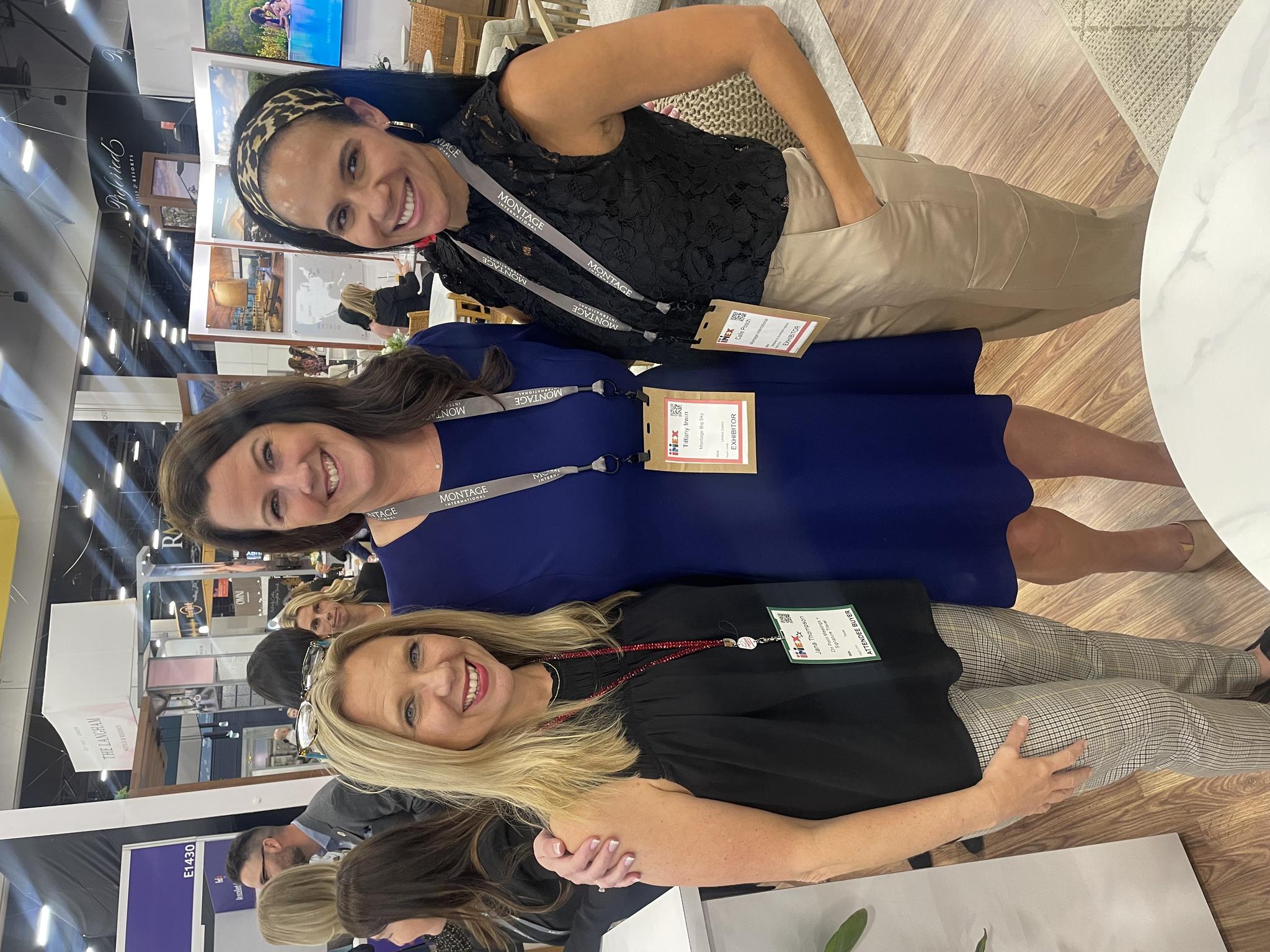 Jana smiling with friends at IMEX