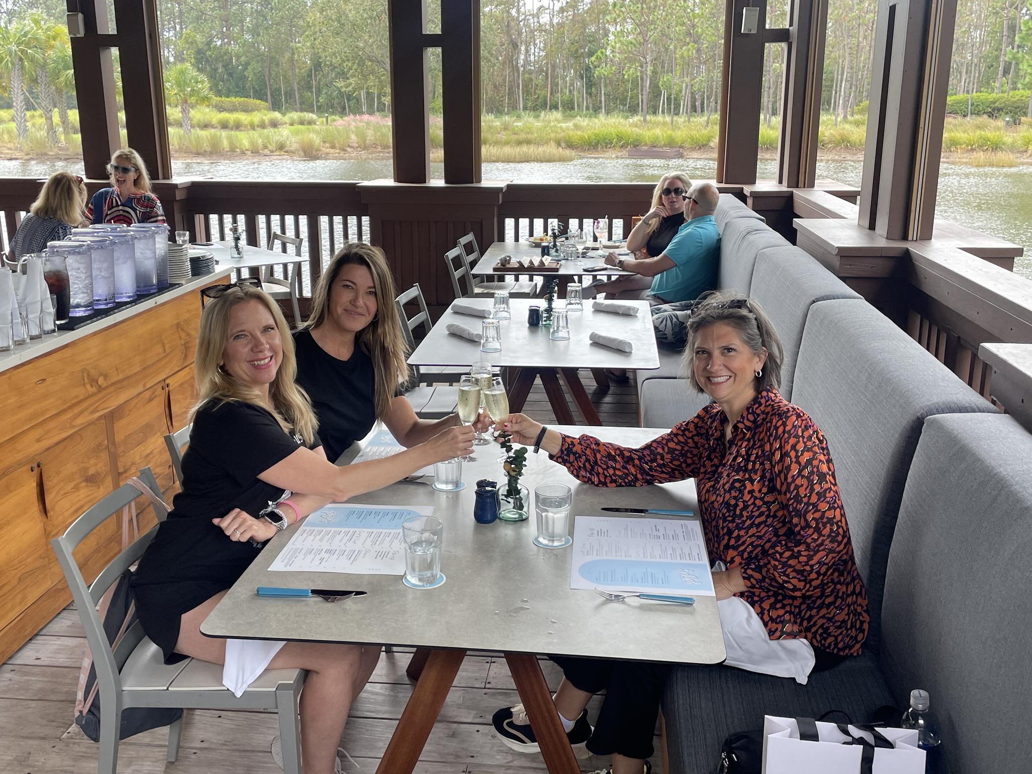Jana enjoying a glass of wine on vacation with family